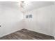 Minimalist bedroom featuring fresh paint, vinyl floors, light fixture, and a window at 1496 Greenwillow Dr, Conley, GA 30288