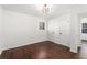 A bedroom with hardwood floors, two closets, and a modern ceiling light at 1496 Greenwillow Dr, Conley, GA 30288