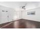 Bright living room featuring hardwood floors, fresh paint, and a modern ceiling fan at 1496 Greenwillow Dr, Conley, GA 30288