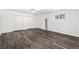 Large living space with fresh paint, vinyl floors, closet, and window at 1496 Greenwillow Dr, Conley, GA 30288