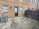 Cozy back patio with brick exterior, privacy fence and door to interior at 235 Winding River Dr # B, Atlanta, GA 30350