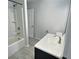 Bright bathroom features modern fixtures, tub and shower, plus stylish tile flooring at 235 Winding River Dr # B, Atlanta, GA 30350