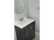 Updated bathroom vanity with modern fixtures, white countertops, and a round mirror at 235 Winding River Dr # B, Atlanta, GA 30350