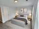 Calm bedroom features plush bedding, neutral walls, and natural light at 235 Winding River Dr # B, Atlanta, GA 30350