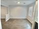 Bright dining area featuring wood floors and neutral walls at 235 Winding River Dr # B, Atlanta, GA 30350