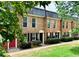Charming brick townhomes with well-maintained landscaping and neutral colors at 235 Winding River Dr # B, Atlanta, GA 30350