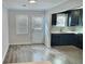 Charming kitchen featuring dark cabinetry, stainless faucet, and natural light at 235 Winding River Dr # B, Atlanta, GA 30350
