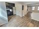 Open-concept kitchen showcasing stainless steel appliances and dark cabinets in a well-lit space at 235 Winding River Dr # B, Atlanta, GA 30350