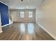 Bright living room showcases stylish wood floors and fresh, neutral paint at 235 Winding River Dr # B, Atlanta, GA 30350