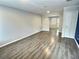 Spacious living room featuring sleek wood floors and natural light at 235 Winding River Dr # B, Atlanta, GA 30350