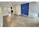 Open-concept living room offers wood floors and a stylish staircase at 235 Winding River Dr # B, Atlanta, GA 30350