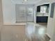 Bright living room featuring sleek wood floors and access to the kitchen at 235 Winding River Dr # B, Atlanta, GA 30350