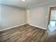 Living room with contemporary flooring, neutral wall, modern door, and great natural light at 235 Winding River Dr # B, Atlanta, GA 30350