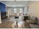 Cozy living area with stylish seating, wood flooring, and a blue accent wall at 235 Winding River Dr # B, Atlanta, GA 30350