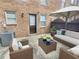 Inviting outdoor patio features comfortable seating beneath a large umbrella at 235 Winding River Dr # B, Atlanta, GA 30350