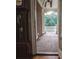 View from inside of the home looking out to a brick balcony with forest views at 2650 Riverfront Dr, Snellville, GA 30039
