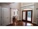 Welcoming foyer with decorative front doors, elegant trim, and a glimpse into the dining room at 2650 Riverfront Dr, Snellville, GA 30039