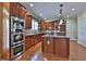 Well-appointed kitchen featuring custom cabinetry, granite countertops, stainless steel appliances, and hardwood floors at 2650 Riverfront Dr, Snellville, GA 30039
