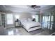 This main bedroom is spacious with a sitting area, tray ceilings and a ceiling fan at 2650 Riverfront Dr, Snellville, GA 30039