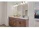 Stylish bathroom featuring a double vanity with granite countertop and modern fixtures for a sophisticated look at 523 Lanier Way, Temple, GA 30179