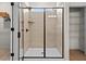 Modern bathroom with a glass-enclosed shower, tiled walls, and a convenient built-in shelf at 523 Lanier Way, Temple, GA 30179