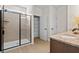Bathroom featuring a glass-enclosed shower, wood-look tile flooring, and a storage closet at 523 Lanier Way, Temple, GA 30179