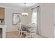 Charming dining area features hardwood floors, pendant lighting, and an adjacent window at 523 Lanier Way, Temple, GA 30179