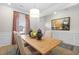 Elegant dining room featuring an elegant wooden table and artistic decorations at 523 Lanier Way, Temple, GA 30179