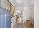 Inviting foyer with wood flooring, decorative molding and trim, leading to an open-concept living space at 523 Lanier Way, Temple, GA 30179