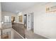 Upstairs hallway featuring 9' ceilings, showing access to other rooms with neutral carpeting and modern fixtures at 523 Lanier Way, Temple, GA 30179