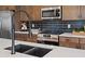 Modern kitchen showcasing a black sink, stainless steel appliances, and white countertops at 523 Lanier Way, Temple, GA 30179