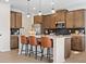 A stylish kitchen features a center island with seating and stainless steel appliances at 523 Lanier Way, Temple, GA 30179
