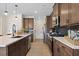 Spacious kitchen featuring stainless steel appliances, wood cabinets, and an extended island at 523 Lanier Way, Temple, GA 30179