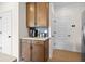 Transitional style kitchen offers rich wood cabinets and a beverage center at 523 Lanier Way, Temple, GA 30179