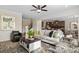 Spacious living room with open floor plan and eat-in kitchen area with sleek counter seating at 523 Lanier Way, Temple, GA 30179