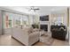 Cozy living room with large windows, a fireplace, and stylish decor at 523 Lanier Way, Temple, GA 30179