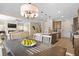 Open concept living space includes dining, kitchen, and living room area at 523 Lanier Way, Temple, GA 30179