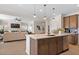 Open kitchen and living space featuring a center island and fireplace at 523 Lanier Way, Temple, GA 30179