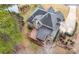 Stunning aerial view of a house featuring a deck, manicured landscaping, and a long driveway at 925 Sentry Ridge Xing, Suwanee, GA 30024