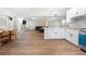Open basement layout with barstool seating, eat in dining and a full kitchen at 925 Sentry Ridge Xing, Suwanee, GA 30024