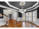 Sophisticated dining room with hardwood floors, chandelier, and lots of natural light at 925 Sentry Ridge Xing, Suwanee, GA 30024