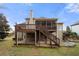 The multi-level deck, featuring a screened-in porch above a covered patio, enhances this home's outdoor living at 925 Sentry Ridge Xing, Suwanee, GA 30024