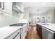 Gourmet kitchen with modern appliances, custom backsplash, and a spacious center island at 925 Sentry Ridge Xing, Suwanee, GA 30024