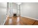 Spacious living room with a fireplace, tall windows, and gleaming hardwood floors at 925 Sentry Ridge Xing, Suwanee, GA 30024