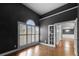 Stylish office space with dark walls, hardwood floors, and elegant French doors at 925 Sentry Ridge Xing, Suwanee, GA 30024