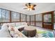 Inviting screened porch with comfortable seating, stylish decor, and wooded views, perfect for relaxation at 925 Sentry Ridge Xing, Suwanee, GA 30024
