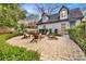 Backyard patio with a fire pit and Adirondack chairs at 1466 University Dr, Atlanta, GA 30306