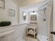 Bathroom features a shower, a toilet, a sink, and updated tile flooring at 1466 University Dr, Atlanta, GA 30306
