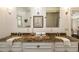 A spacious Primary bath featuring a double vanity with granite countertops and elegant modern finishes at 1466 University Dr, Atlanta, GA 30306