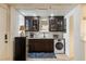 This functional kitchen features dark cabinetry, modern appliances, and a washer/dryer at 1466 University Dr, Atlanta, GA 30306